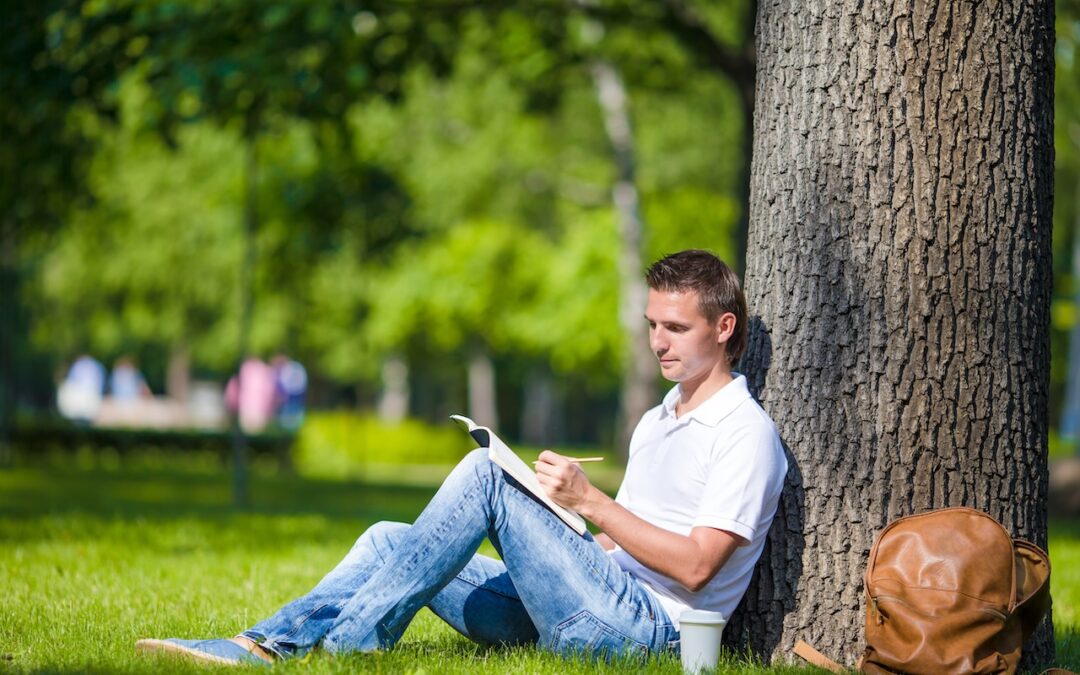student studying in one of the parks in athens ohio