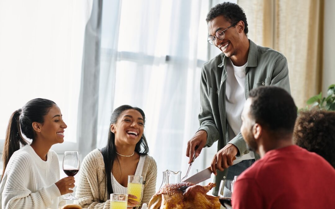 friends having friendsgiving in off campus apartment